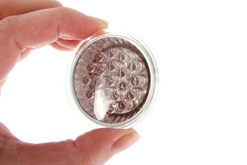 Led bulb in woman's hand on white background