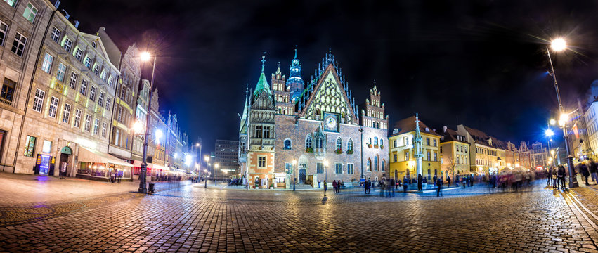 Wroclaw Market Square with Town Hall. Night scene with long exposure motion blurred people
