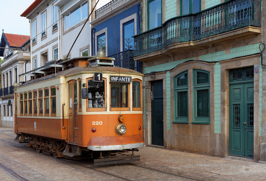 Old yellow Porto tramway in the side of Douro River in a day.Ipomoea purpurea ,