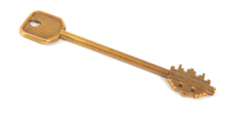 old brass key on white background