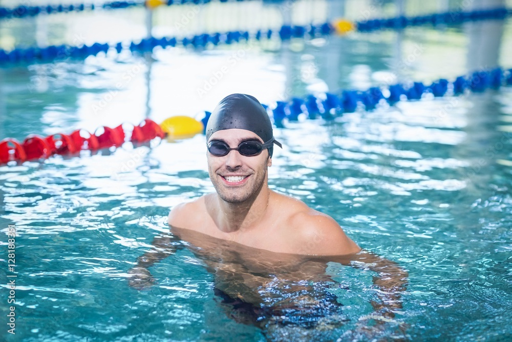 Wall mural handsome man swimming