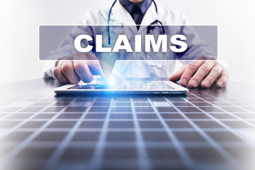 Medical doctor working with modern computer and selecting claims. Medical concept.