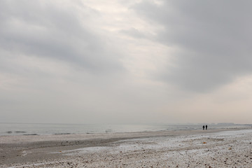 Winter black sea beach in winter sky landscape