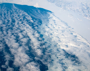 Fototapeta premium Aerial view of the Greenland cloudy coastline