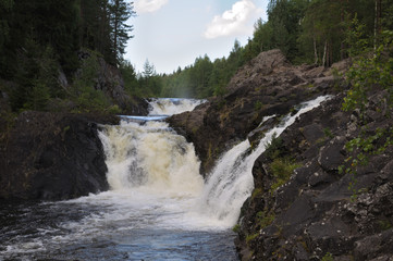 Fototapeta na wymiar Full view of the Kivach waterfall