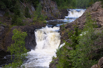 Fototapeta na wymiar The full view of Kivach waterfall