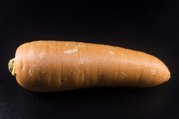 close up macro detail carrot on black background