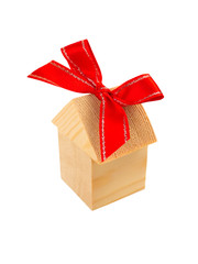 Building blocks home with a red bow