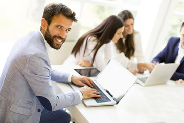 Modern businessman with laptop