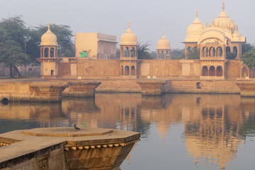 Fototapeta na wymiar Kusum Sarovar Govardhan Mandir. This lake is one of the most visited places in Mathura. Next to it there are numerous temples and ashrams. Uttar Pradesh, India.