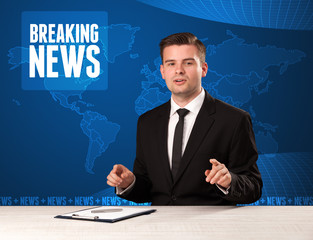 Television presenter in front telling breaking news with blue mo