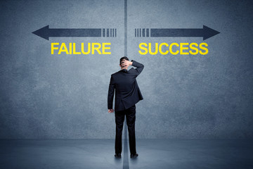 Fototapeta na wymiar Businessman standing in front of success and failure arrow conce