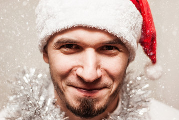 Happy bearded happy man with red hat, studio shot.