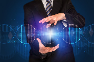 Businessman holding DNA