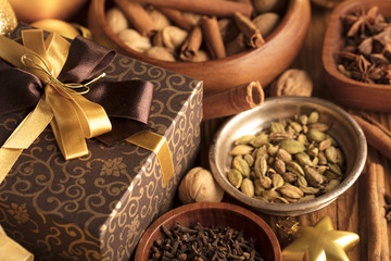 Christmas theme. Presents on a wooden table. Golden and brownish aesthetics.