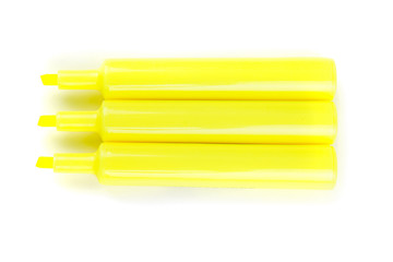 Three yellow highlighters isolated on white background