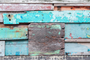 Wood material background for old Vintage wallpaper for background,exposed wooden wall exterior, patchwork of raw wood forming a beautiful parquet wood pattern