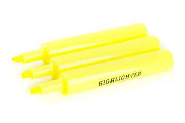 Three yellow highlighters isolated on white background