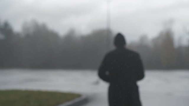 Running man in the rain