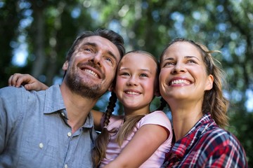 Happy parents with daughter in back yard