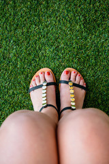 Feet of woman with flip flops