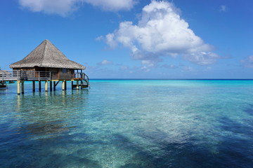 Seascape with overwater bungalow in the lagoon of Rangiroa, south Pacific ocean, Tuamotu, French Polynesia