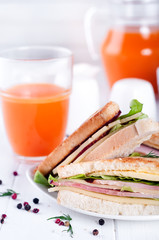 breakfast with club sandwich and juice