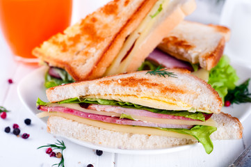 breakfast with club sandwich and juice