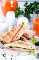 breakfast with club sandwich and juice