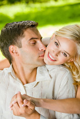 Fototapeta premium happy attractive couple walking together, outdoors