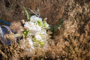 Beautiful white flowers for rustic wedding decoration. Nice David Austin roses. Romantic bouquet for a brice. Blurred background