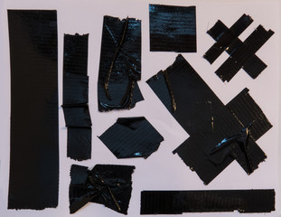 Collection of black duct tape pieces