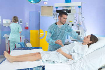 pregnant woman and her husband during visit at the hospital