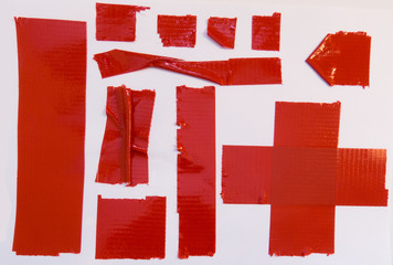 Collection of red duct tape pieces 