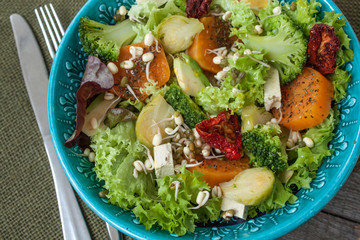 Salad with sweet potatoes, dried tomatoes, avocado, broccoli, brussels sprouts, tofu, mung bean sprouts. Perfect for the detox diet or just a healthy meal.  Love for a healthy raw food concept.