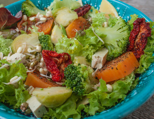Salad with sweet potatoes, dried tomatoes, avocado, broccoli, brussels sprouts, tofu, mung bean sprouts. Perfect for the detox diet or just a healthy meal.  Love for a healthy raw food concept.