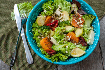 Salad with sweet potatoes, dried tomatoes, avocado, broccoli, brussels sprouts, tofu, mung bean sprouts. Perfect for the detox diet or just a healthy meal.  Love for a healthy raw food concept.