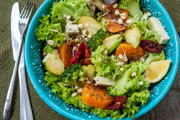 Salad with sweet potatoes, dried tomatoes, avocado, broccoli, brussels sprouts, tofu, mung bean sprouts. Perfect for the detox diet or just a healthy meal.  Love for a healthy raw food concept.