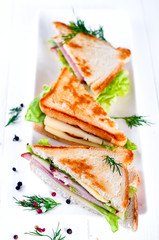 breakfast with club sandwich and juice