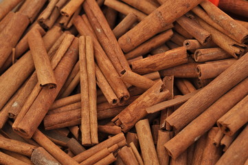 Cinnamon sticks close up at farmer's market. Background. Texture of cinnamon sticks. Top view.