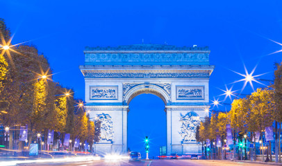 The Triumphal Arch and Champs Elysees venue at night, Paris, Fra