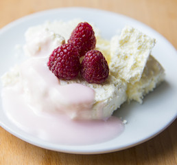 Cottage cheese in plate with berries