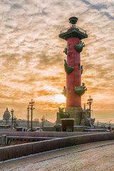 Fototapeta na wymiar rostral column at sunset in winter in St. Petersburg, Russia