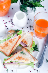 breakfast with club sandwich and juice