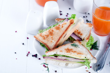 breakfast with club sandwich and juice