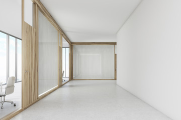 Empty office corridor with a wooden door meeting room