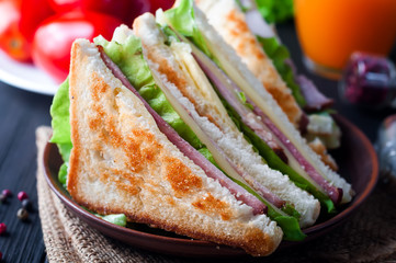 homemade sandwich with salad and juice as a healthy breakfast