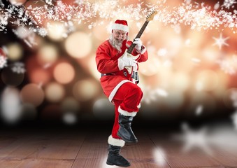 Fototapeta na wymiar Santa claus playing electric guitar on wooden plank 