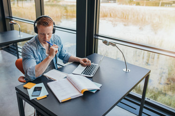 Student preparing school assignment in library