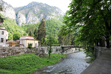 Fototapeta premium City landscape along Cerna River in Herculane, Romania